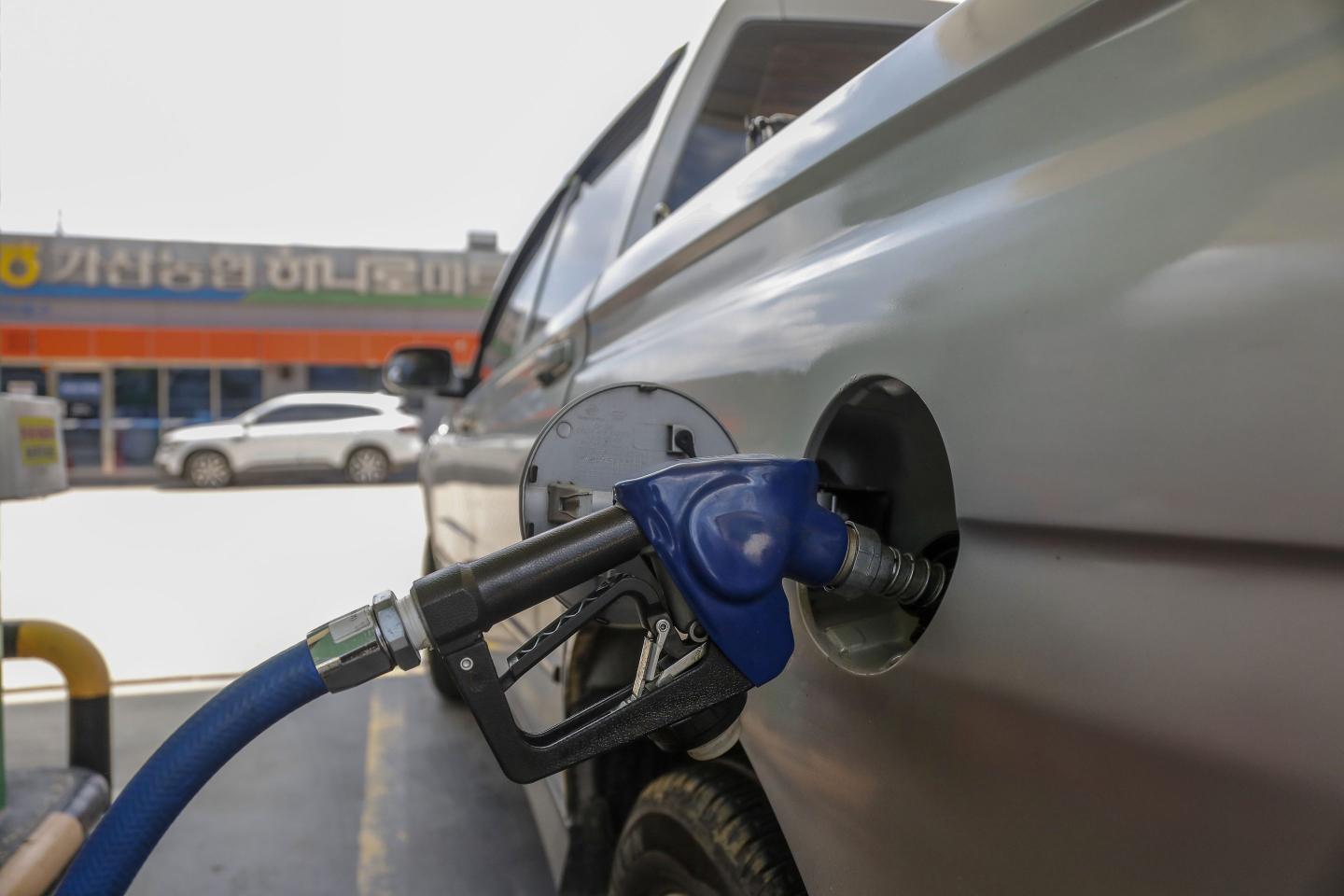 A consumer refuels their vehicle at a gas station in Daegu, South Korea, on June 23, 2025, while geopolitical risks heighten due to U.S. attacks on Iran's nuclear facilities.