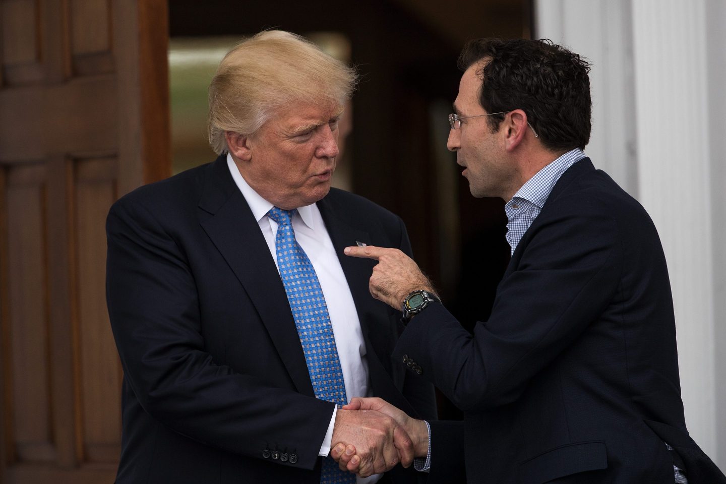 President-elect Donald Trump shakes hands with Jonathan Gray, member of the Board of Directors at Blackstone, following their meeting at Trump International Golf Club, November 20, 2016 in Bedminster Township, New Jersey.