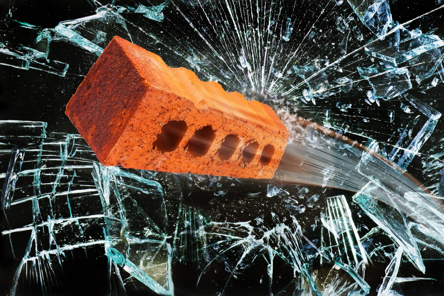 A brick breaking a window