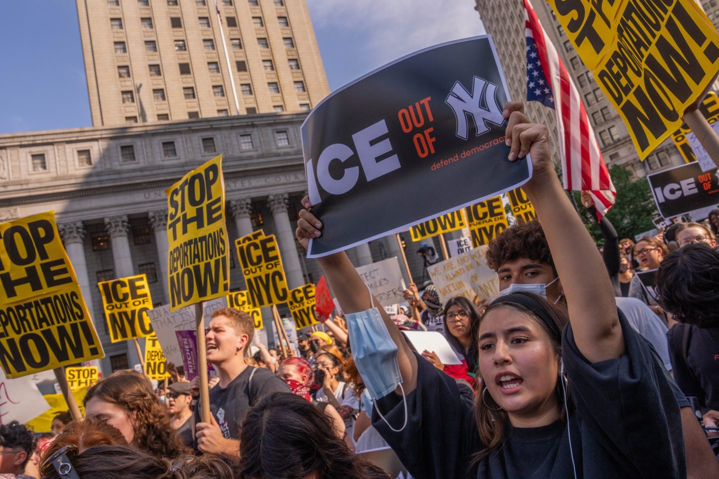 Protesters hold signs saying no to ICE in NYC