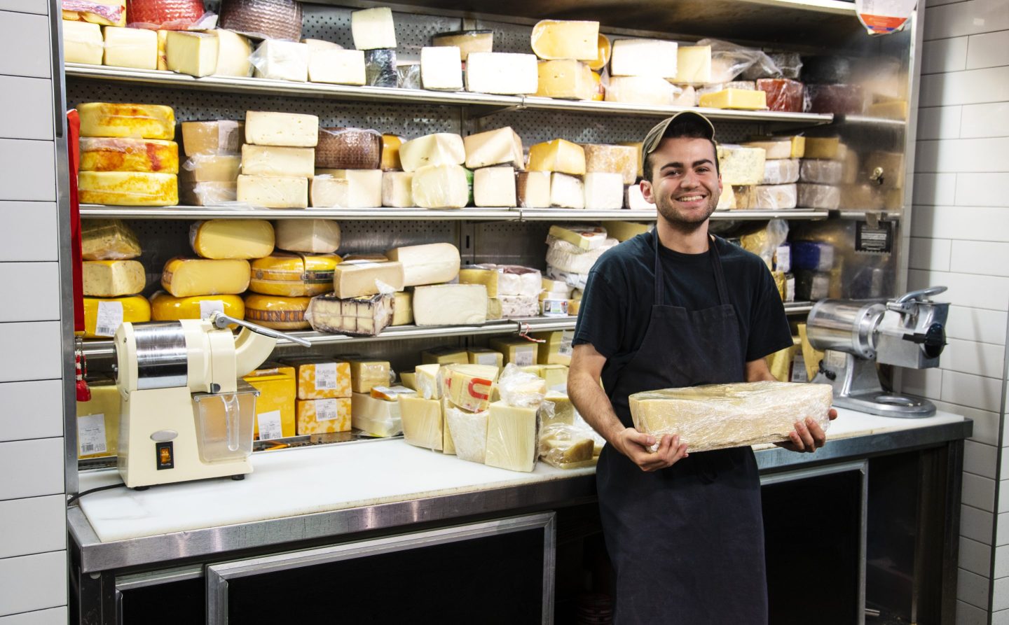 Happy cheese worker