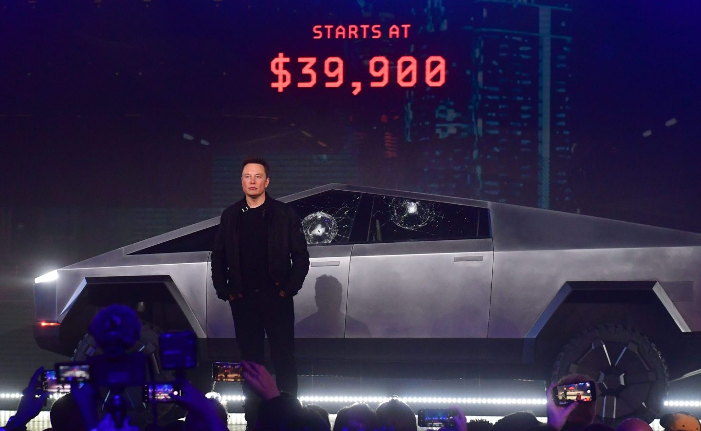 Tesla co-founder and CEO Elon Musk stands in front of the newly unveiled all-electric battery-powered Tesla's Cybertruck at Tesla Design Center in Hawthorne, California on November 21, 2019.