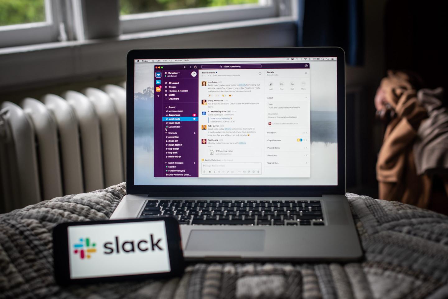 Slack open on a computer, and the Slack logo on a phone
