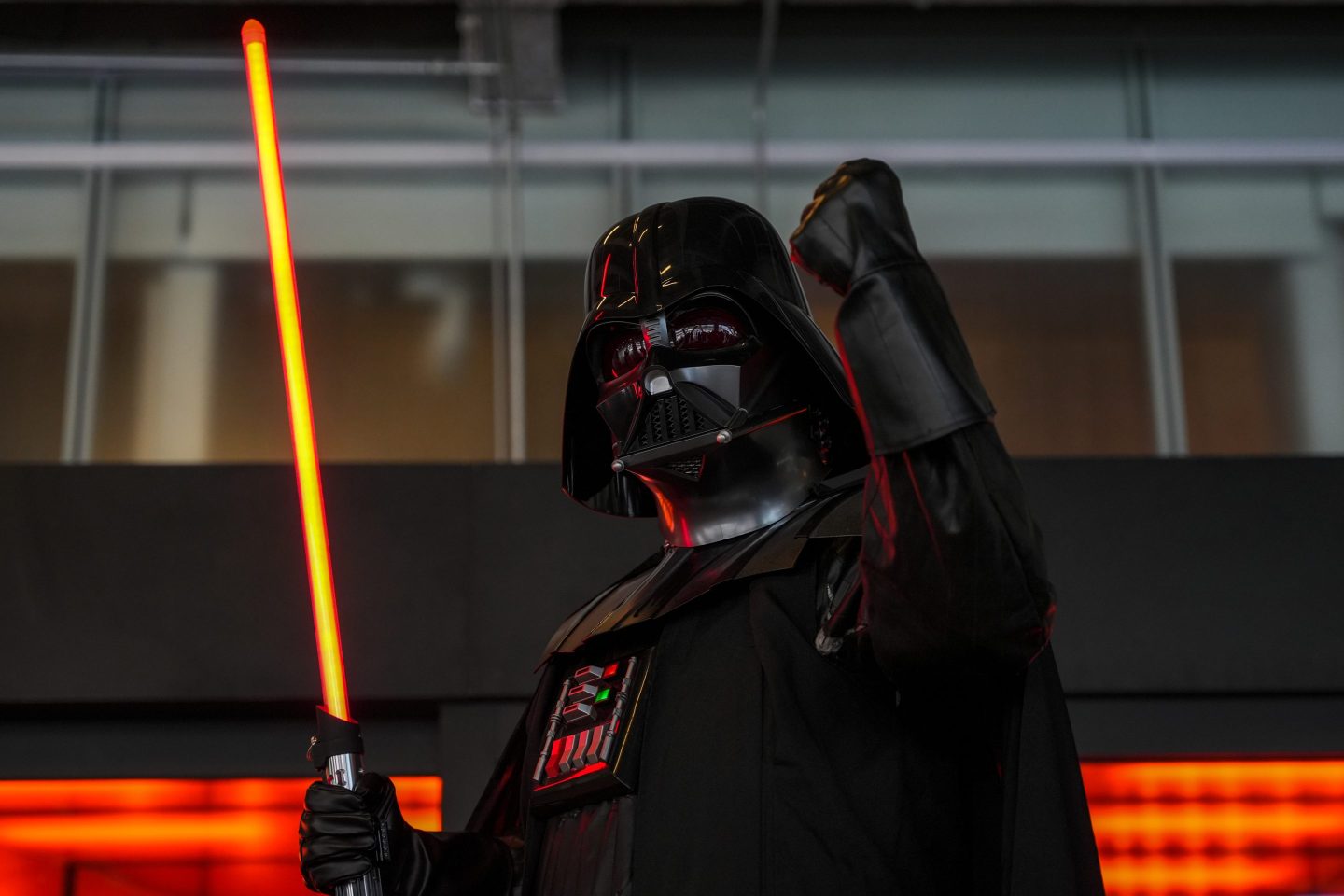 Darth Vader raises his fist, and his lightsaber