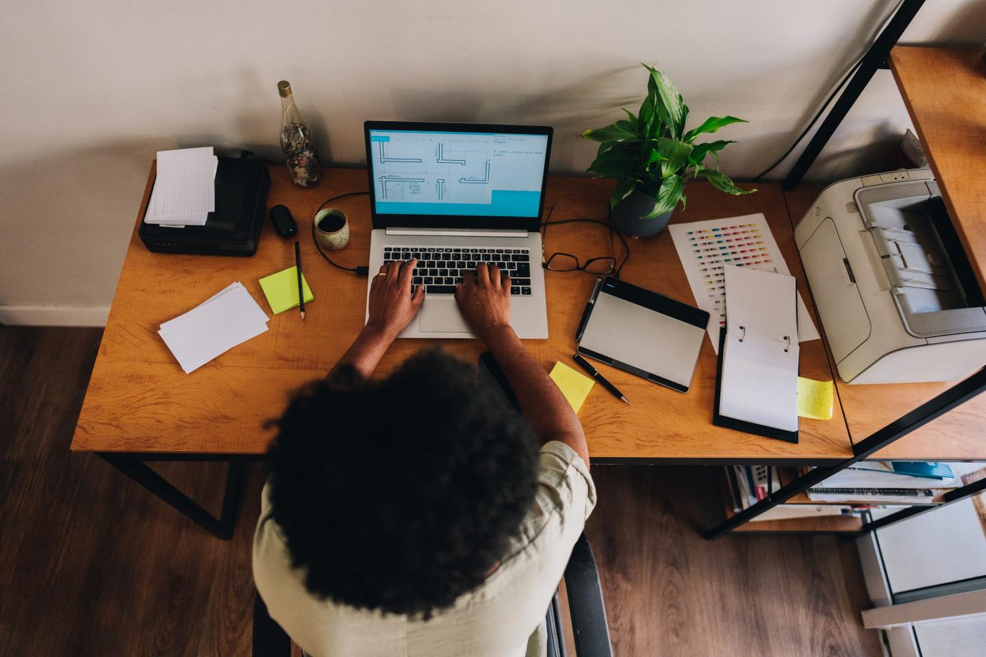 woman working on computer at desk