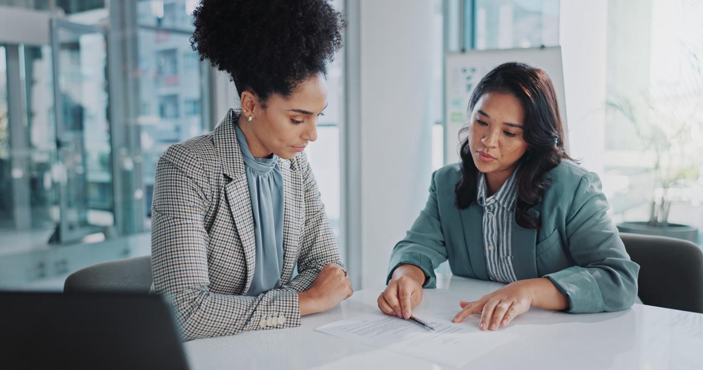 women working on something together