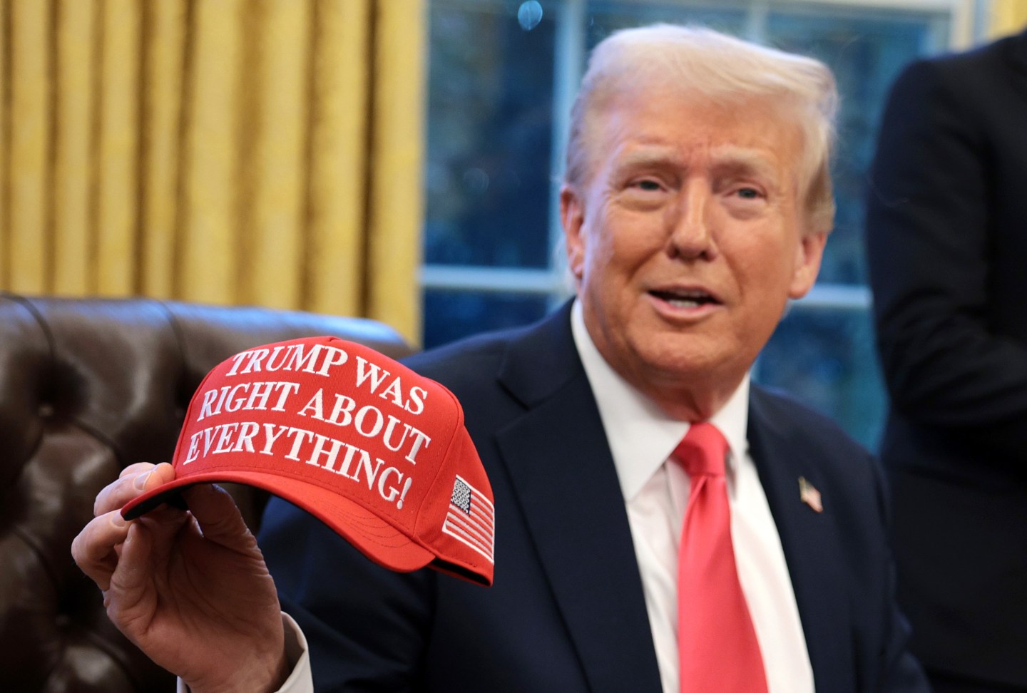 U.S. President Donald Trump signing executive orders in the Oval Office in February 2025.