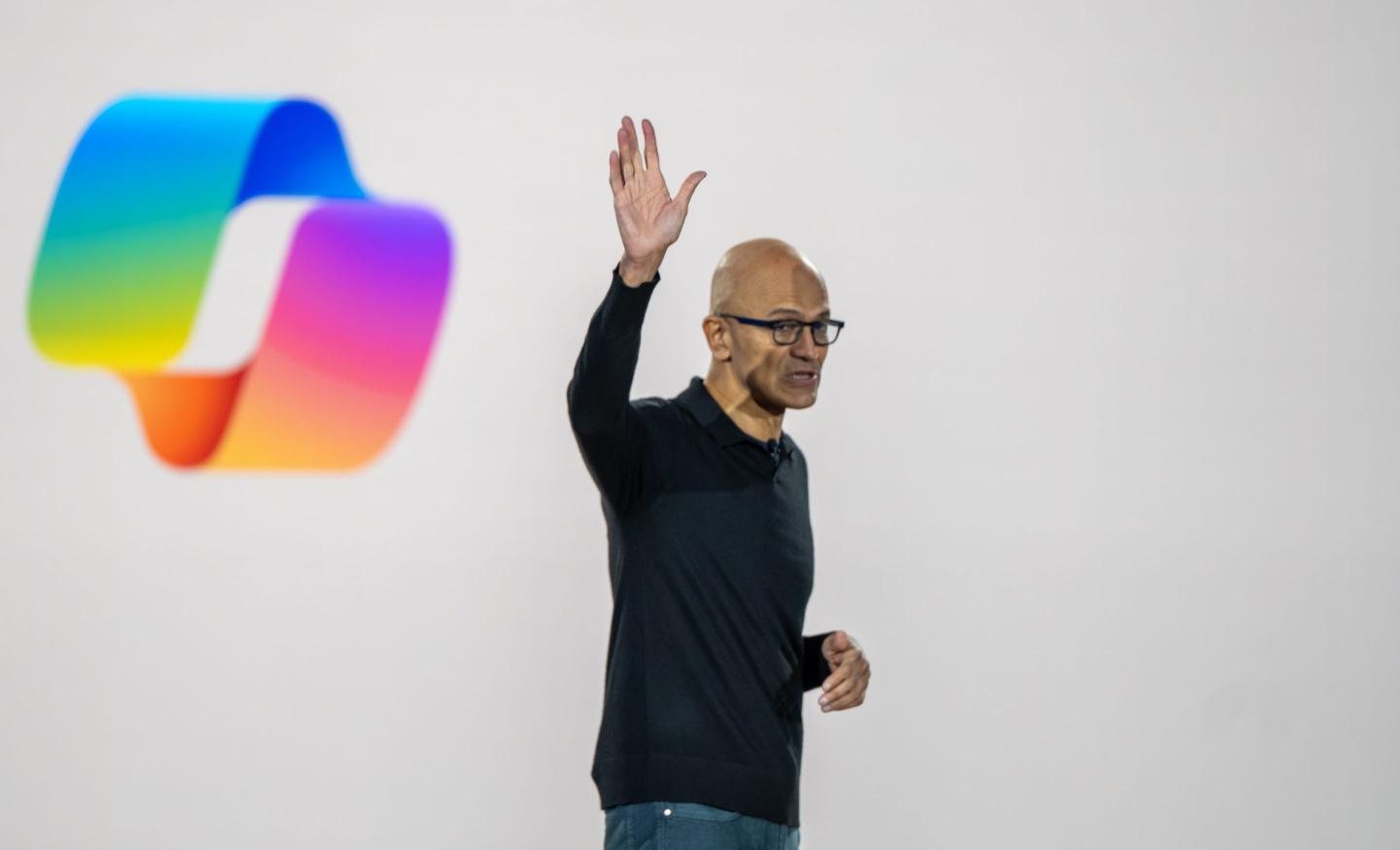 Microsoft CEO Satya Nadella waves during an event celebrating the 50th Anniversary of Microsoft on April 4, 2025 in Redmond, Washington.