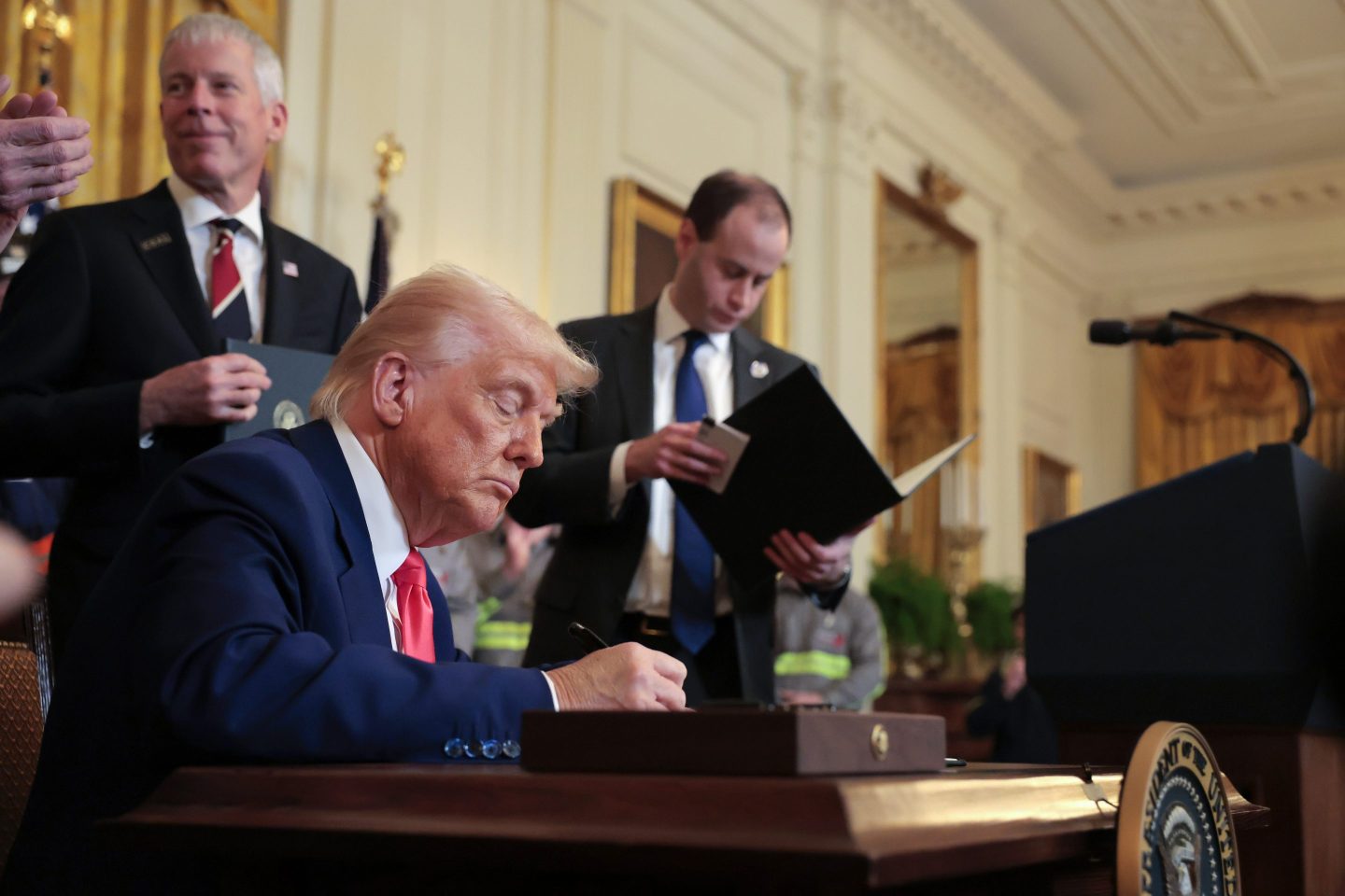 Trump signing papers