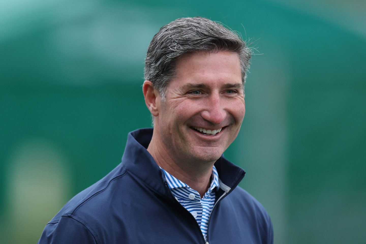 Starbucks CEO Brian Niccol smiles