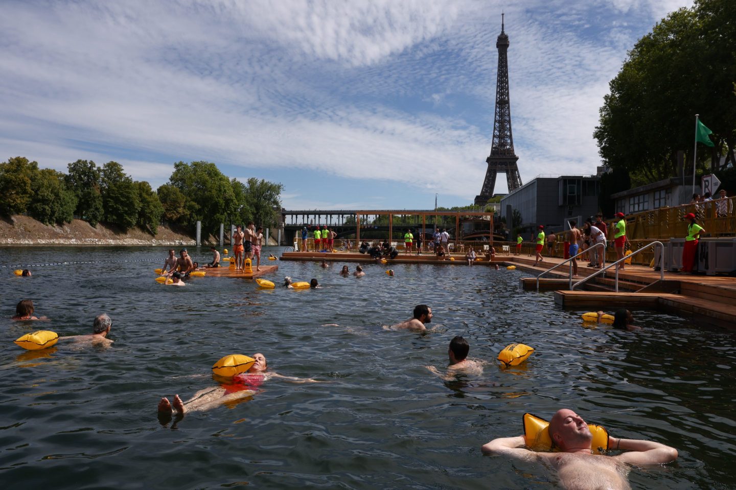 Members of the public swim at the Baignade de Grenelle bathing site on its opening day.