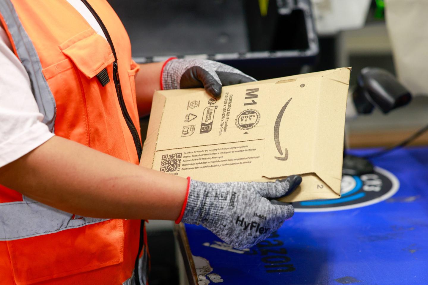 A worker prepares orders at the Amazon.com Inc. fulfillment centre