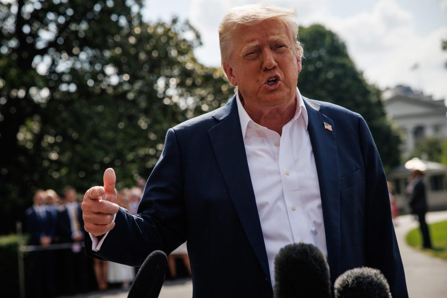 Donald Trump points while talking