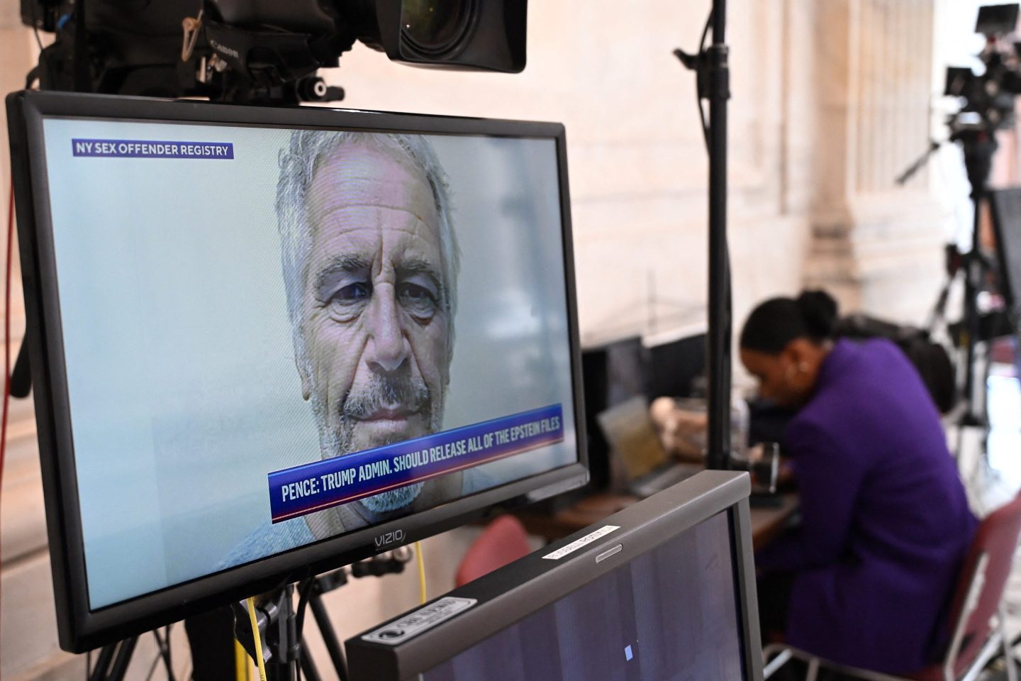 A mugshot of Jeffrey Epstein, former financier and convicted sex offender, is seen on a television at the US Capitol in Washington, DC
