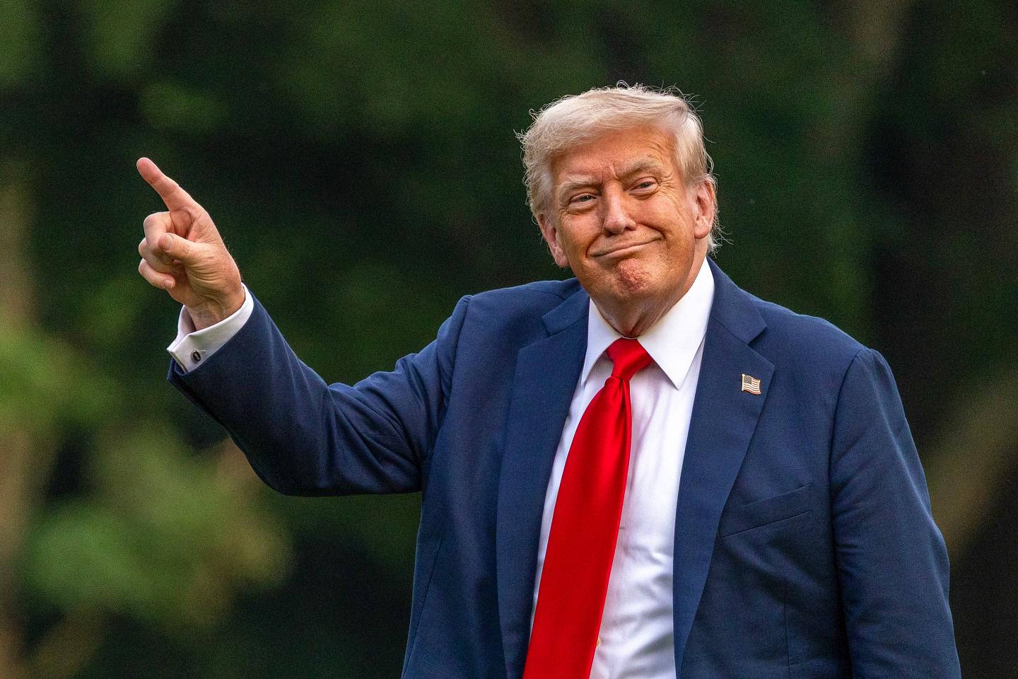 Photo: WASHINGTON, DC - JULY 13: U.S. President Donald Trump walks on the south lawn of the White House and points up at the new flag on July 13, 2025 in Washington, DC. President Trump and first lady Melania Trump spend the afternoon attending the final match of the FIFA Club World Cup at MetLife Stadium in East Rutherford, New Jersey. (Photo by Tasos Katopodis/Getty Images)