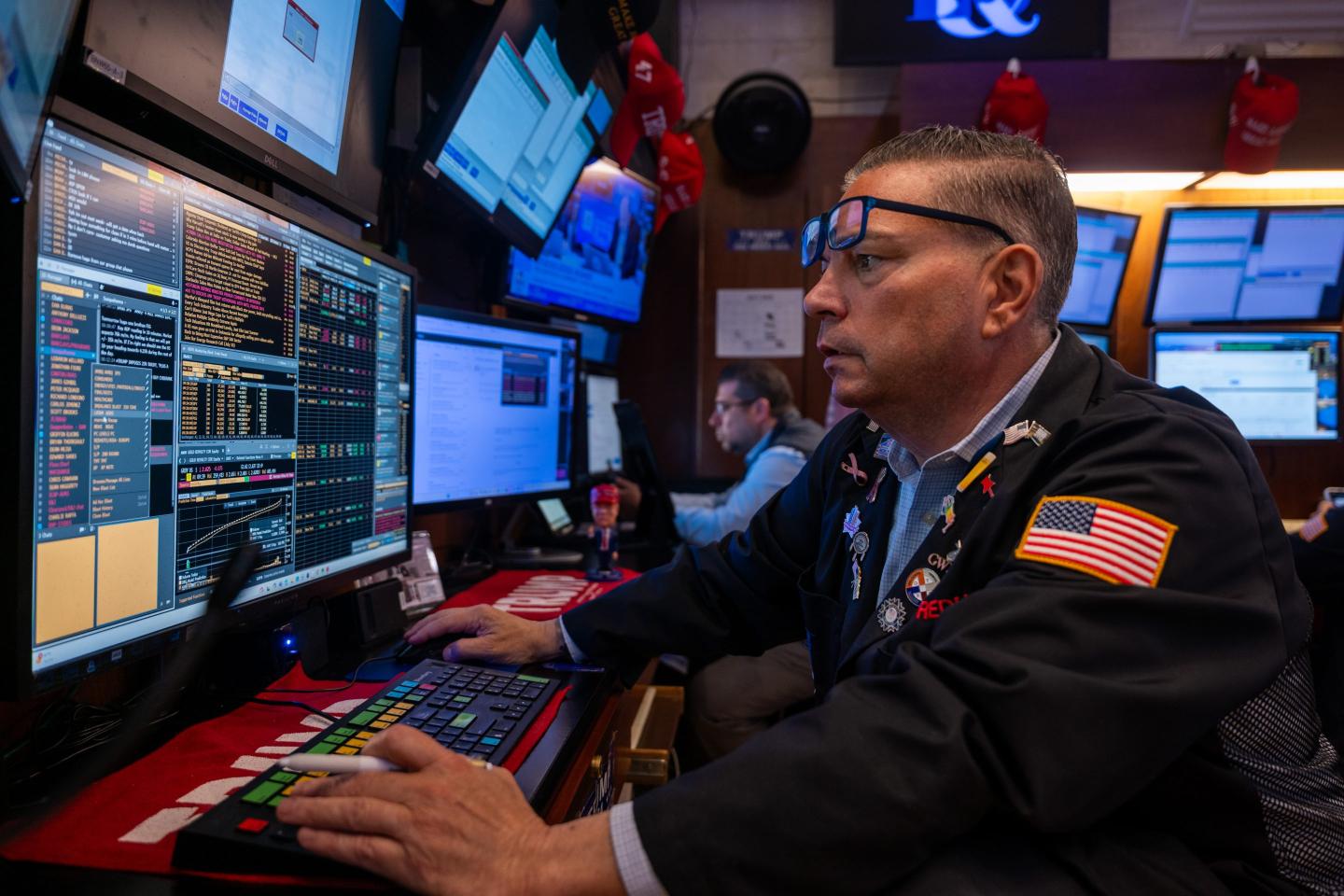 An NYSE trader looks at his computer monitor.