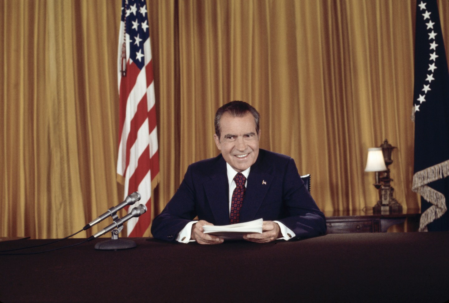 Photo: (Original Caption) President Nixon, in a nationally televised address 8/15, asks for support against "those who would exploit Watergate in order to keep us from doing what we were elected to do." He also proclaimed his innocence of any complicity in the affair. Nixon posed for still photographers after the address, as no pictures were permitted during the telecast.