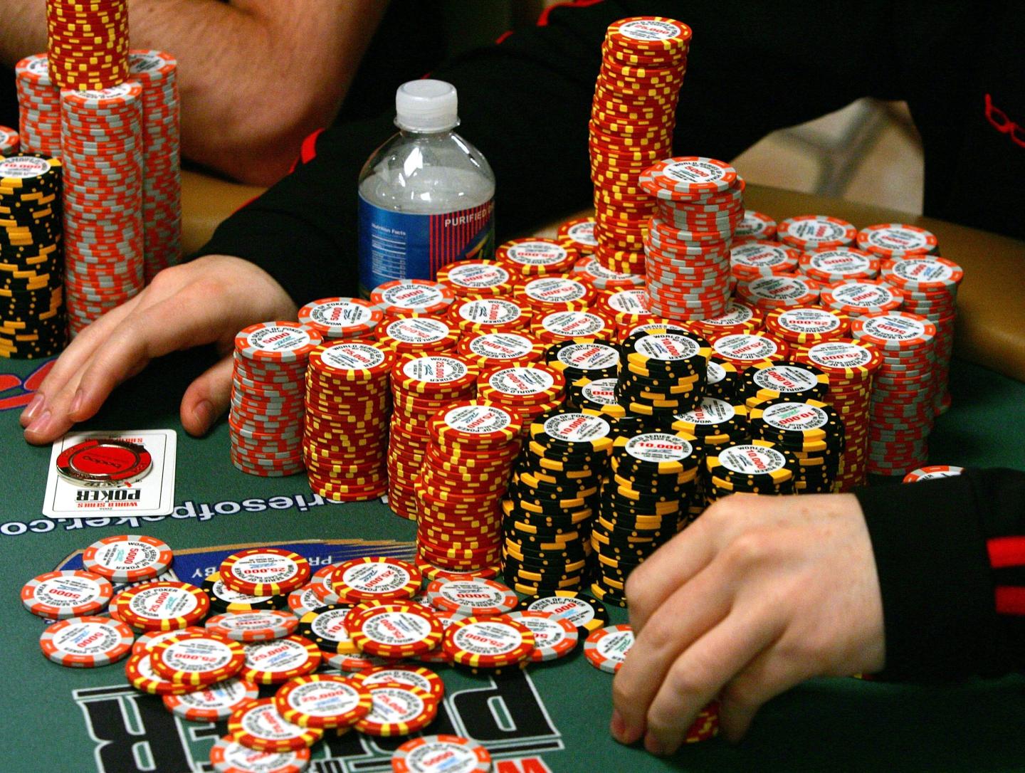 A ton of poker chips stacked up on a table in a Las Vegas casino