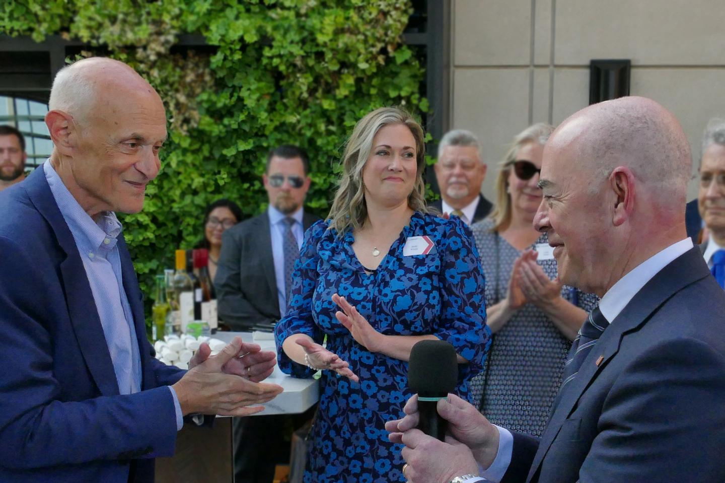 Jacalynne Becker Klopp at an event with Alejandro Mayorkas