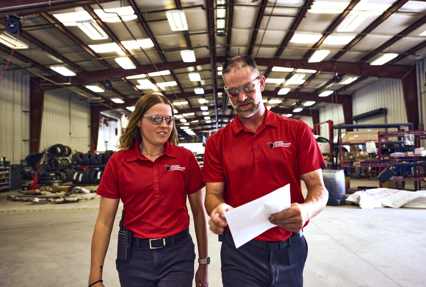 Two Crash Champions workers conversing
