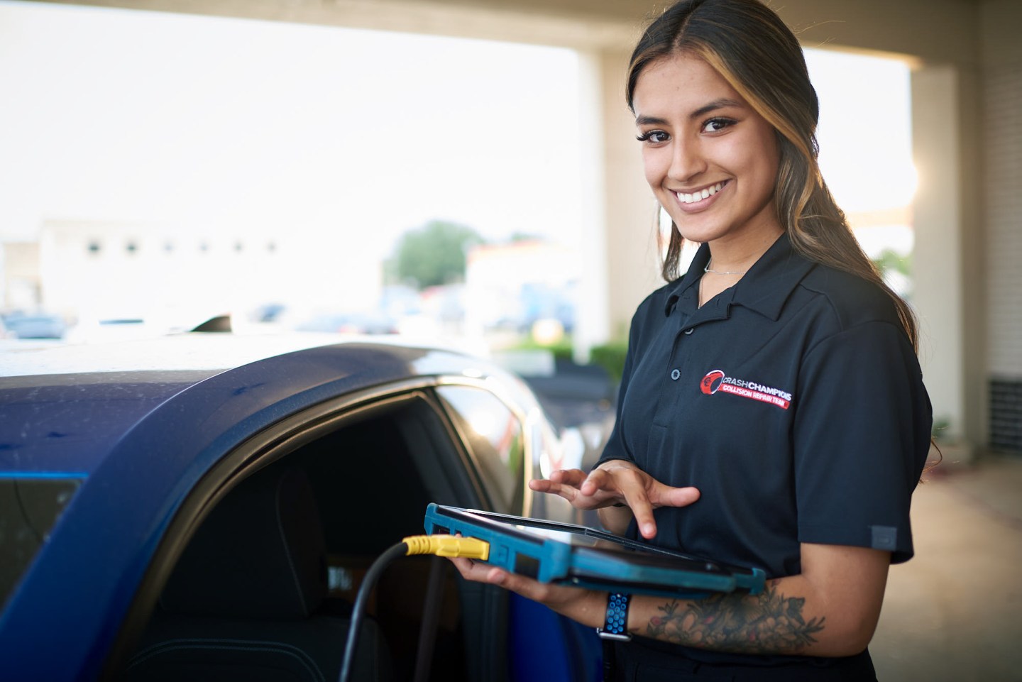 Crash Champions worker with a computer