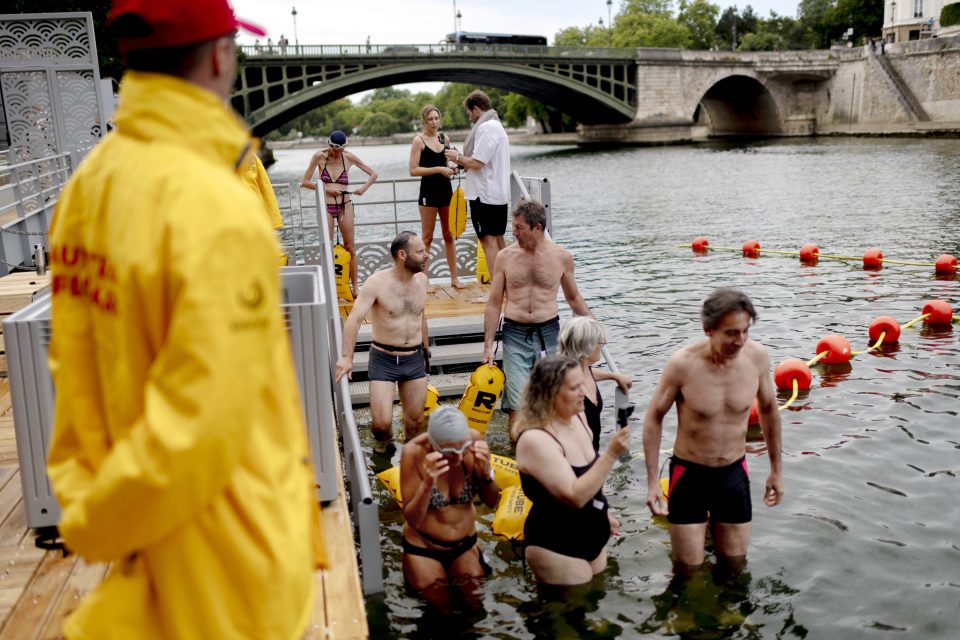 People enter the water at a new designated swimming site.