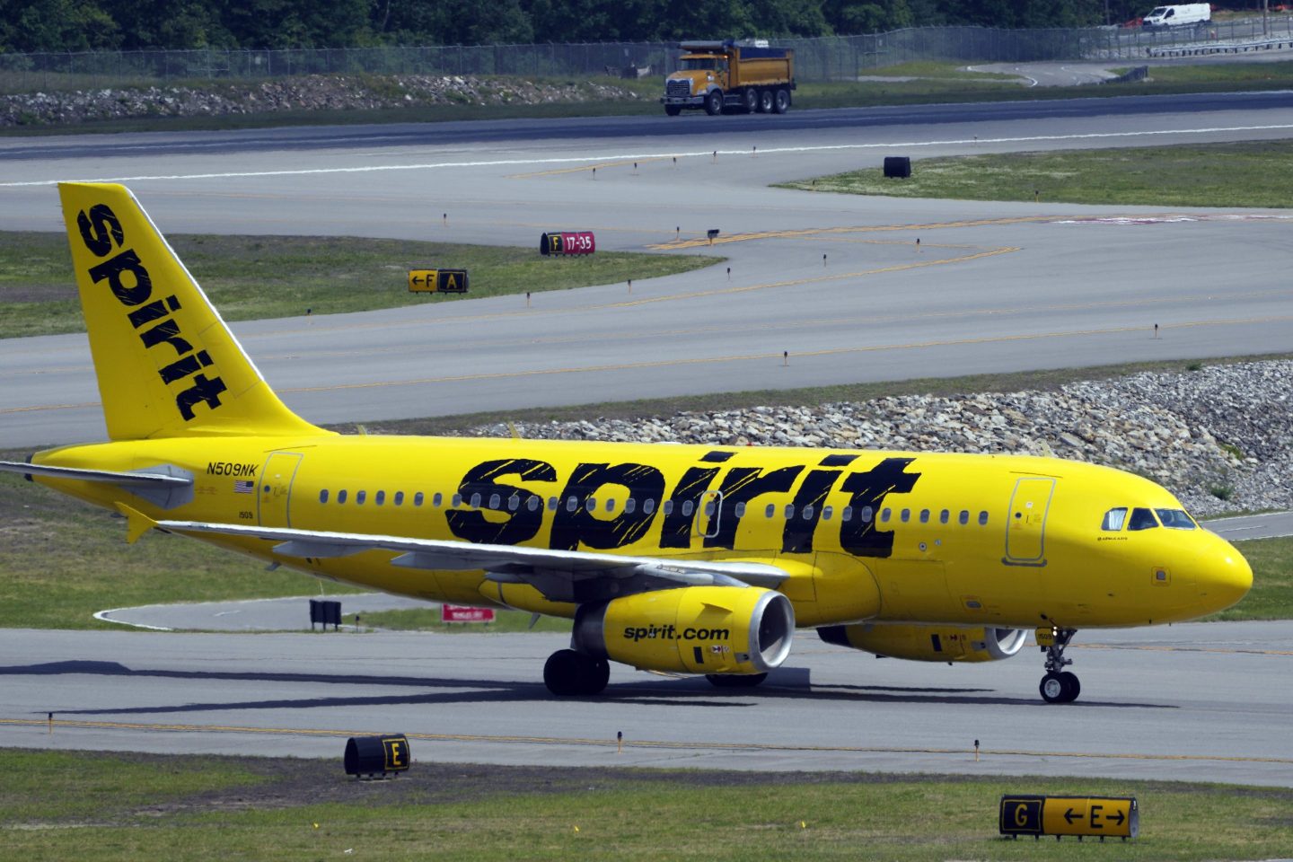 A Spirit Airlines 319 Airbus taxis at Manchester Boston Regional Airport.
