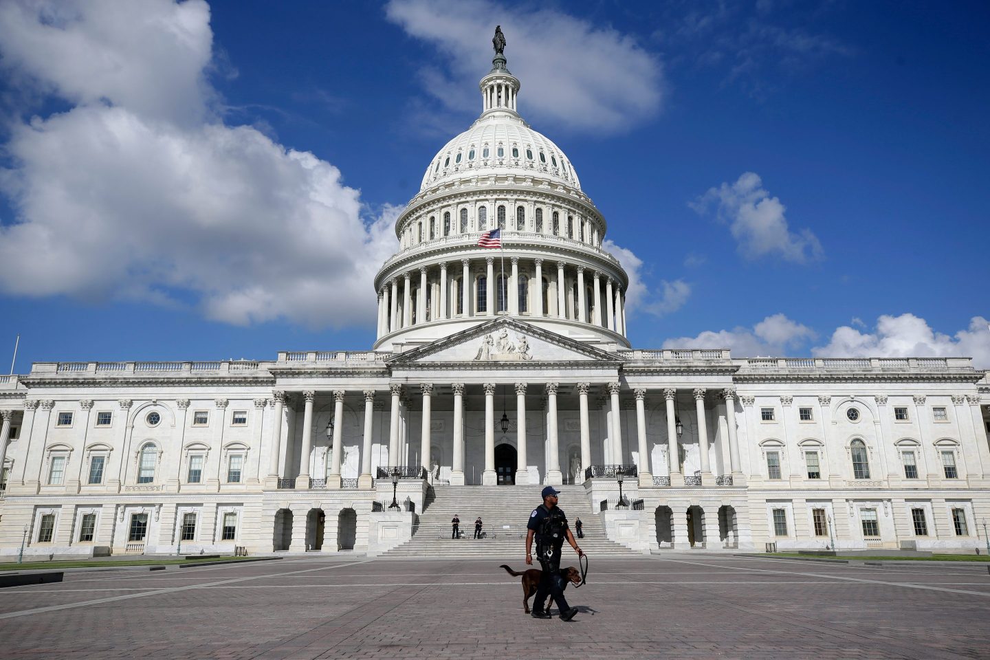 A police officer walks in front of the U.S. Capitol on Aug. 22.