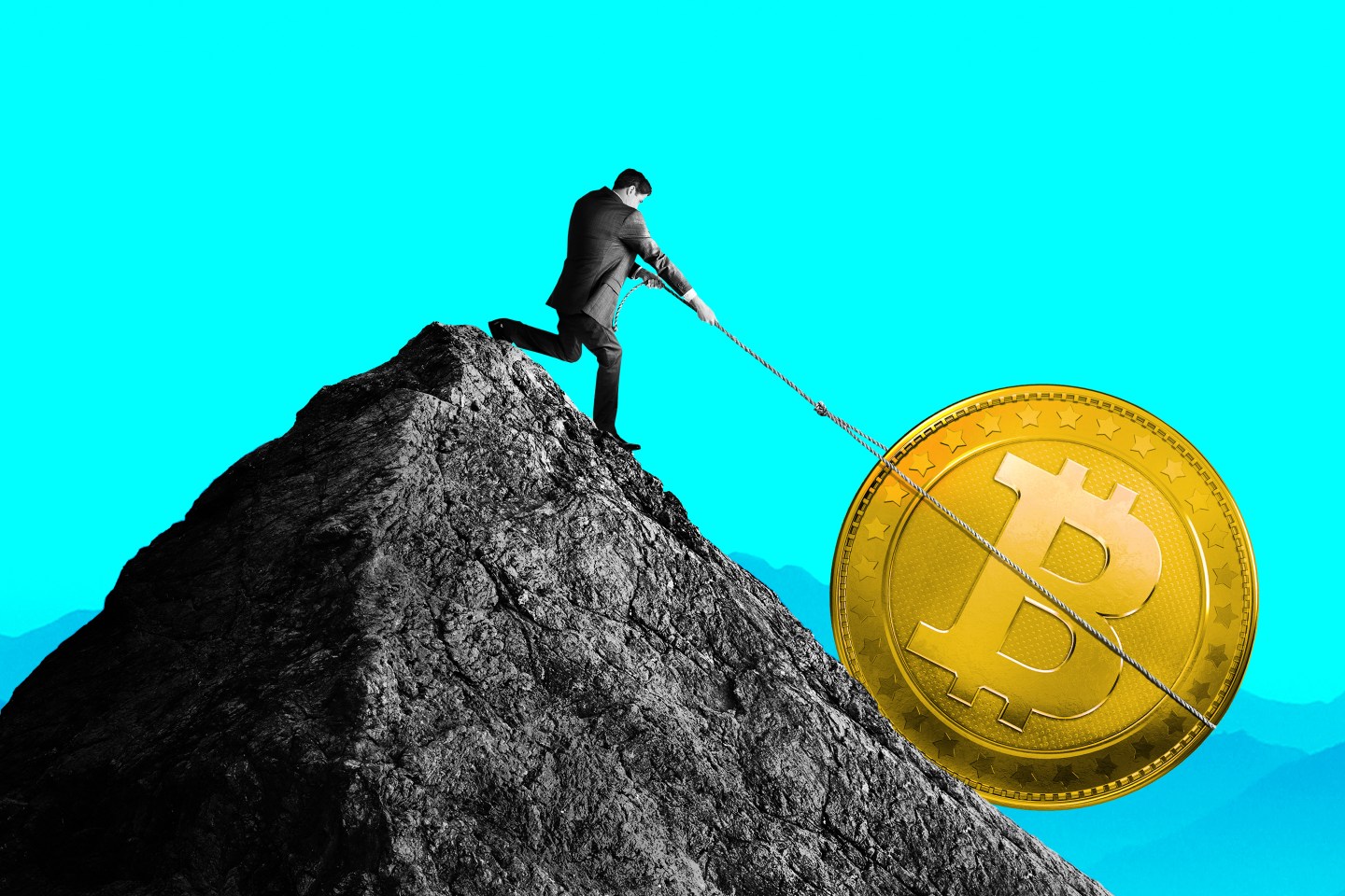 A man tries to pull a coin with the Bitcoin logo back up a mountain.