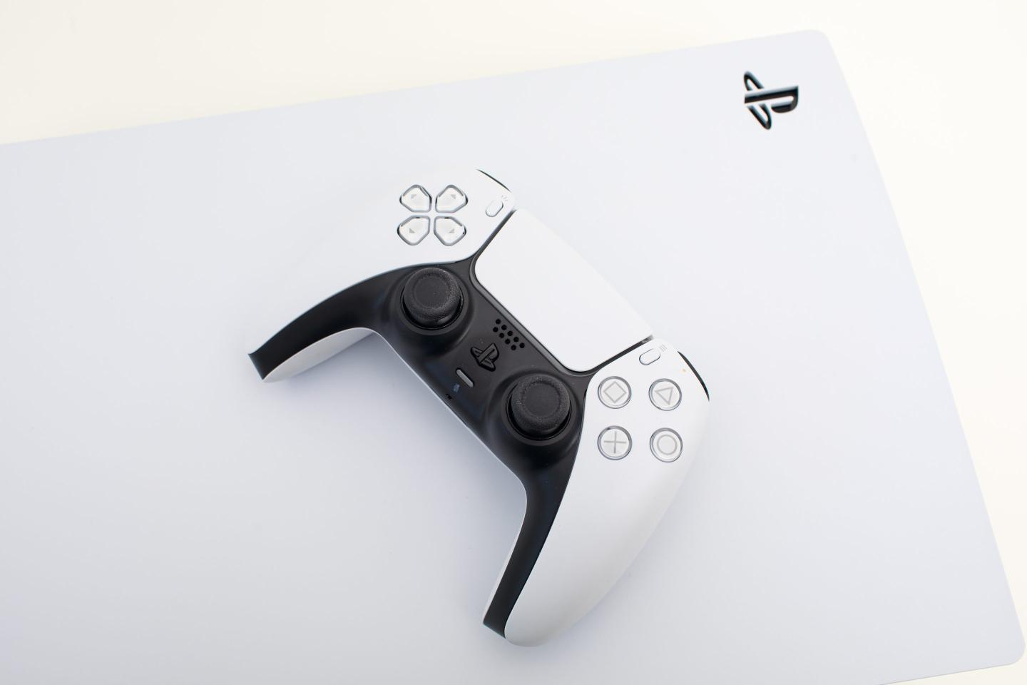 A Playstation 5 console and controller