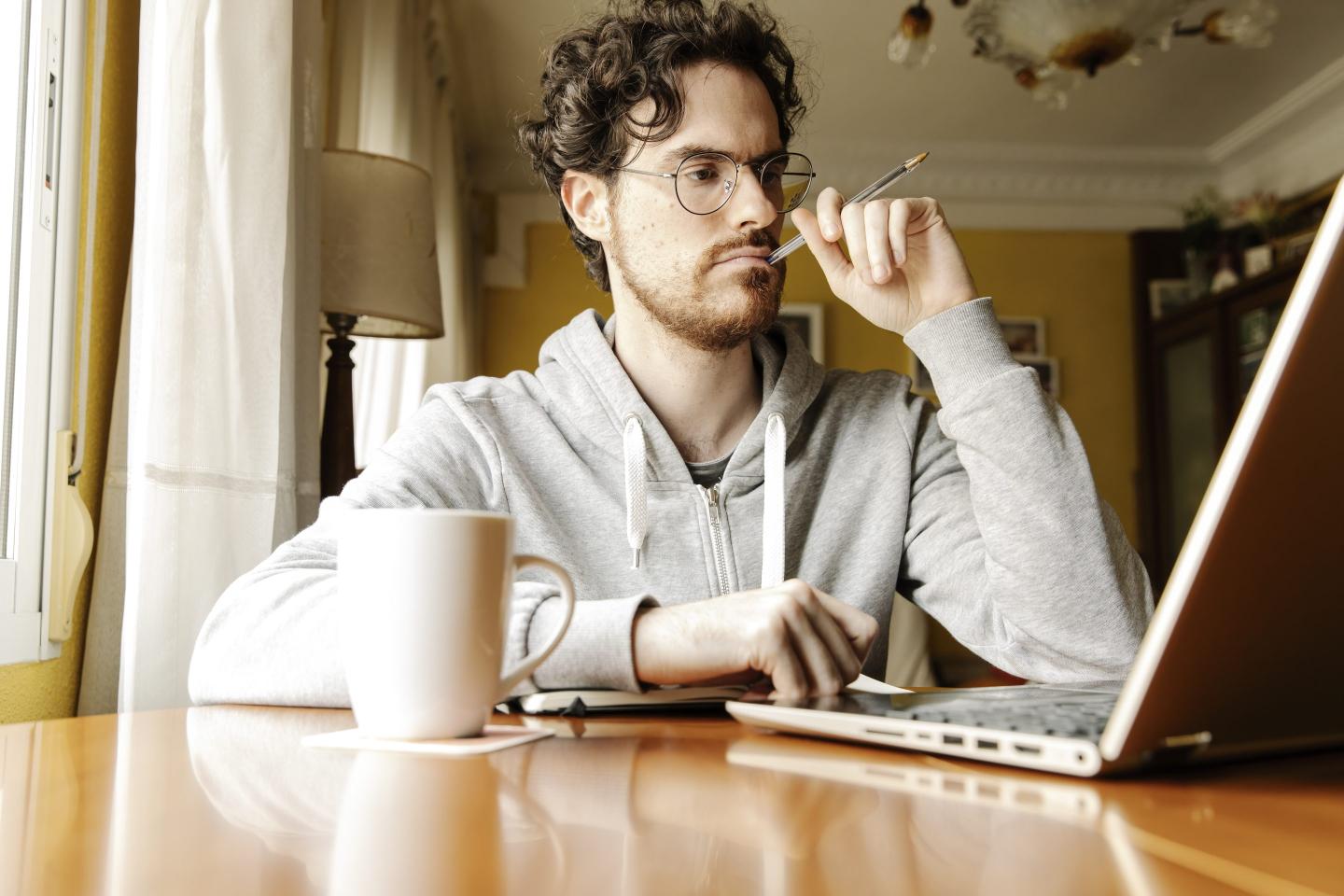 Man working on a laptop at home