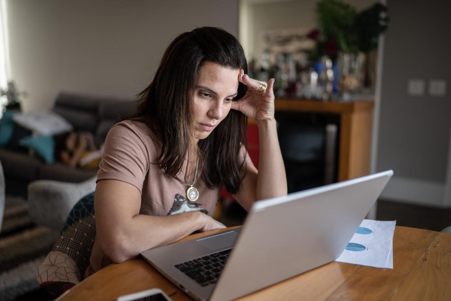 Annoyed worker on laptop