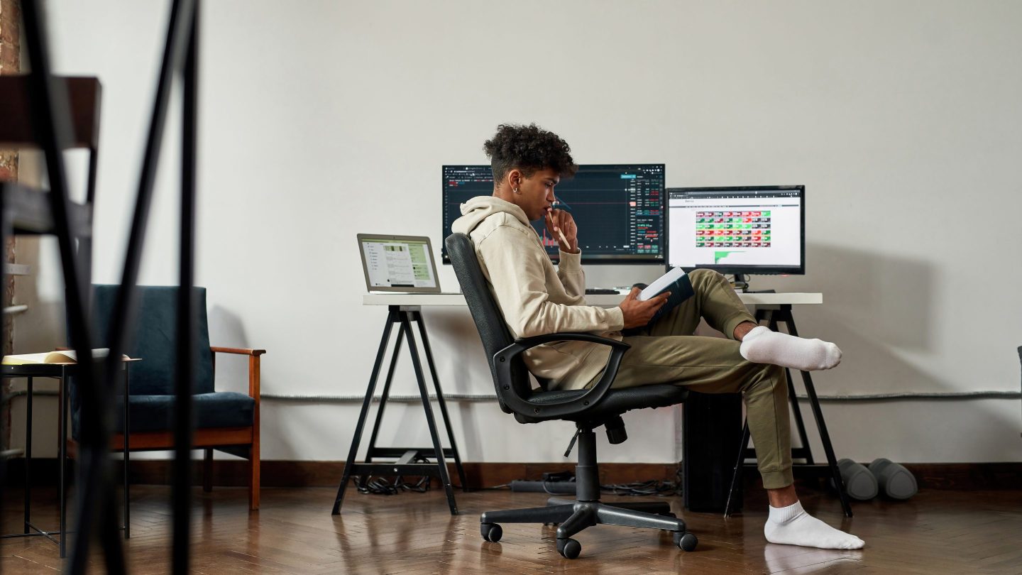 A young man sitting at a desk