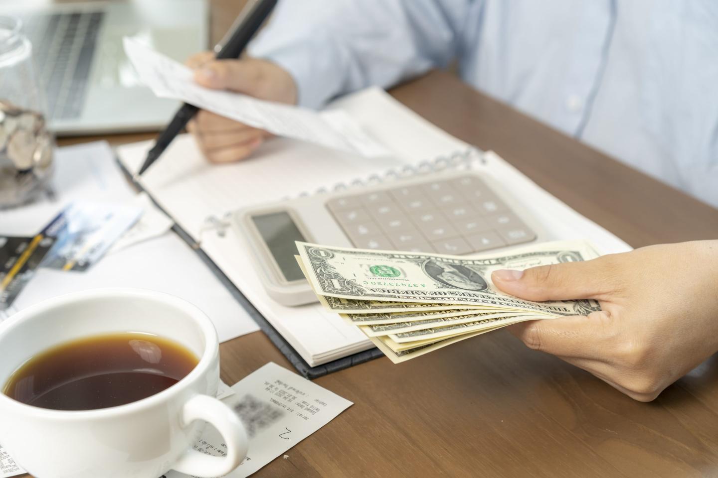 Paying bills on desk