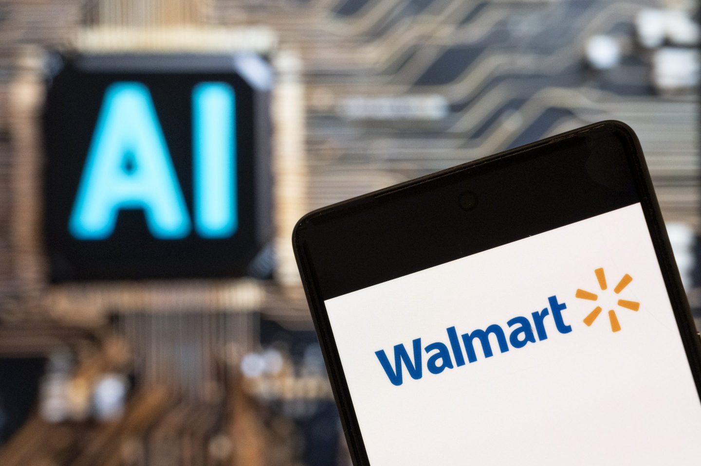 Walmart (NYSE: WMT) logo seen displayed on a smartphone with an Artificial intelligence (AI) chip and symbol in the background.