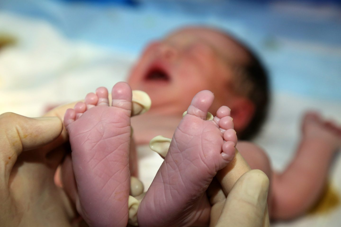A medical worker cares for a newborn "dragon baby" in the maternity department of Zaozhuang Maternal and Child Health Hospital in Shandong province, China, Feb 10, 2024.
