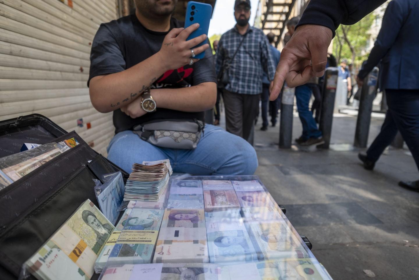 Iran’s currency has plunged so much in value that Tehran plans to chop off four zeros from the rial