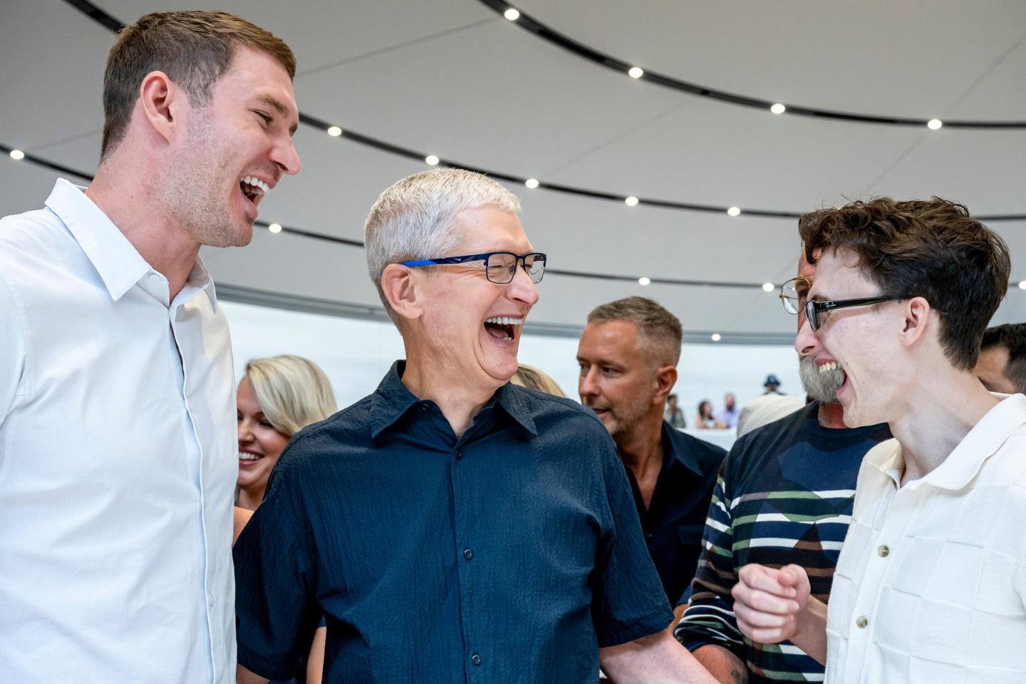 Apple CEO Tim Cook shares some giggles with Ryan Murphy and Stephen Nedoroscik