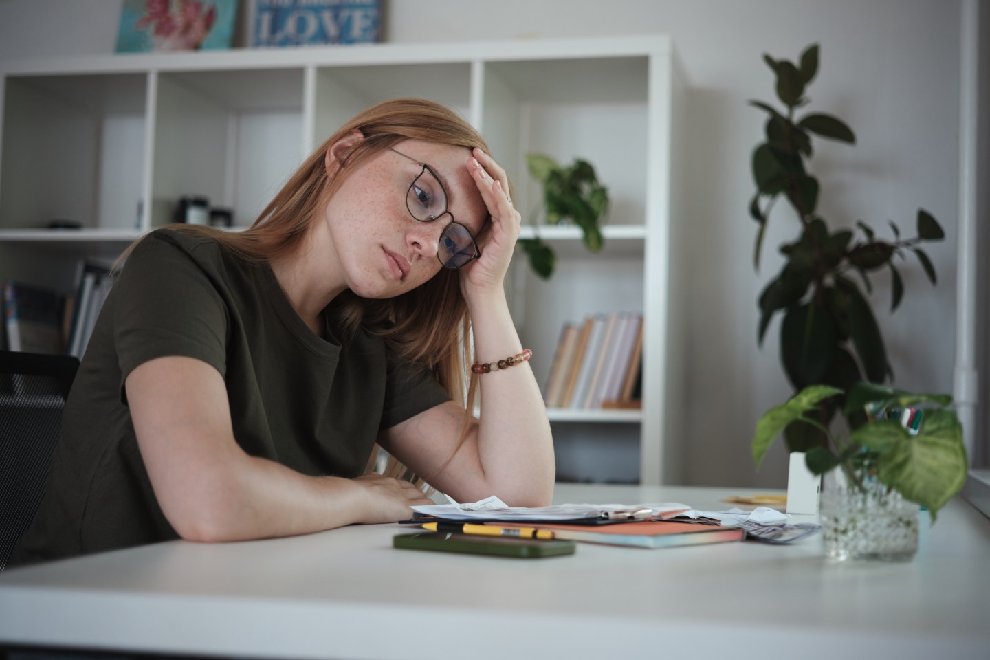 Worried woman at her desk