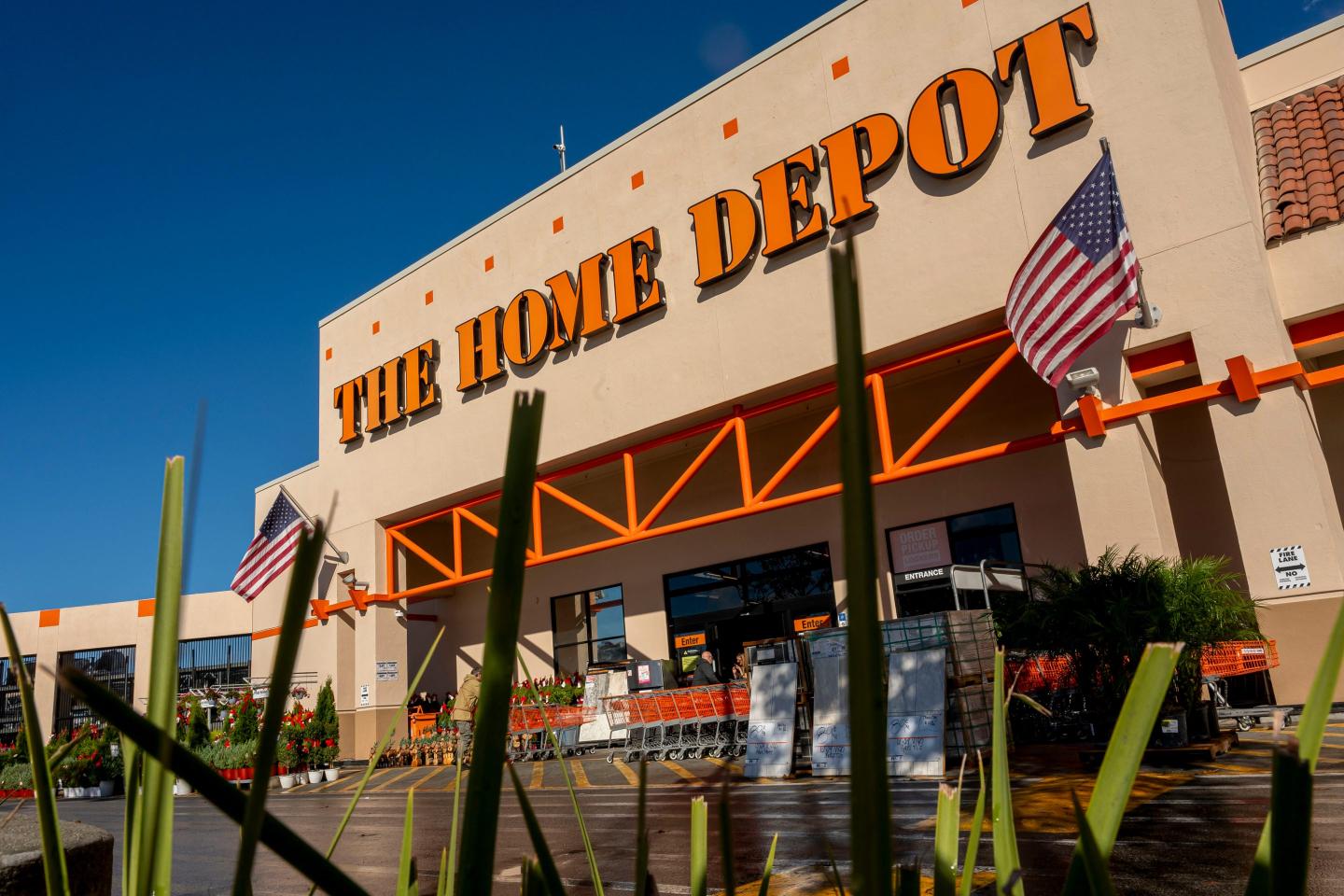 Home Depot says customers are putting off larger home-improvement projects as stubborn interest rates and worries about the economy fester
