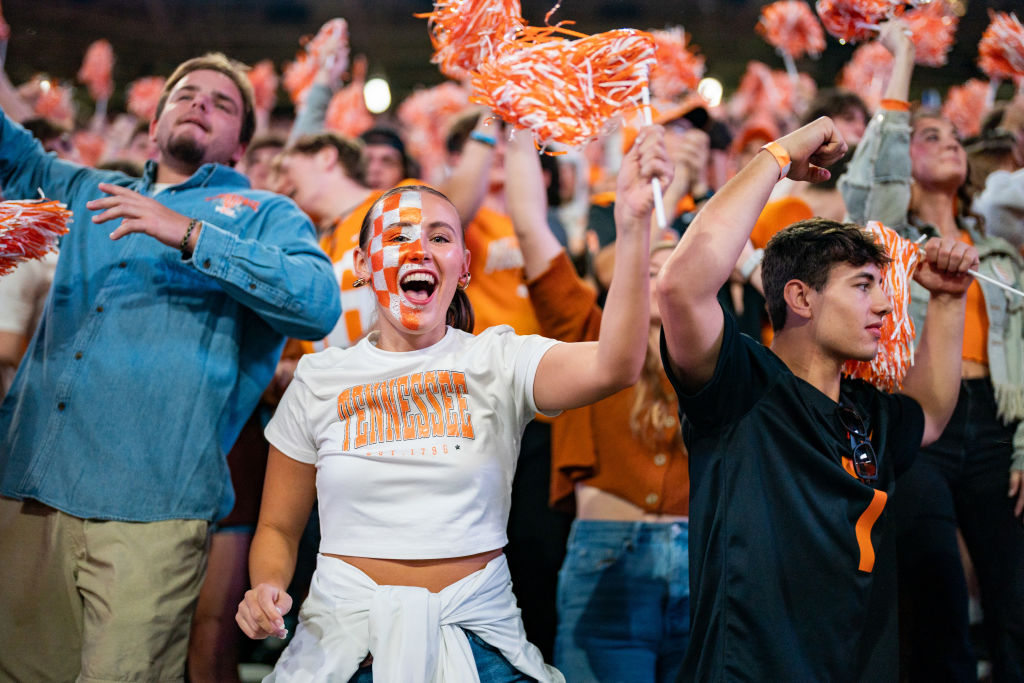 Photo of fans of college football cheering