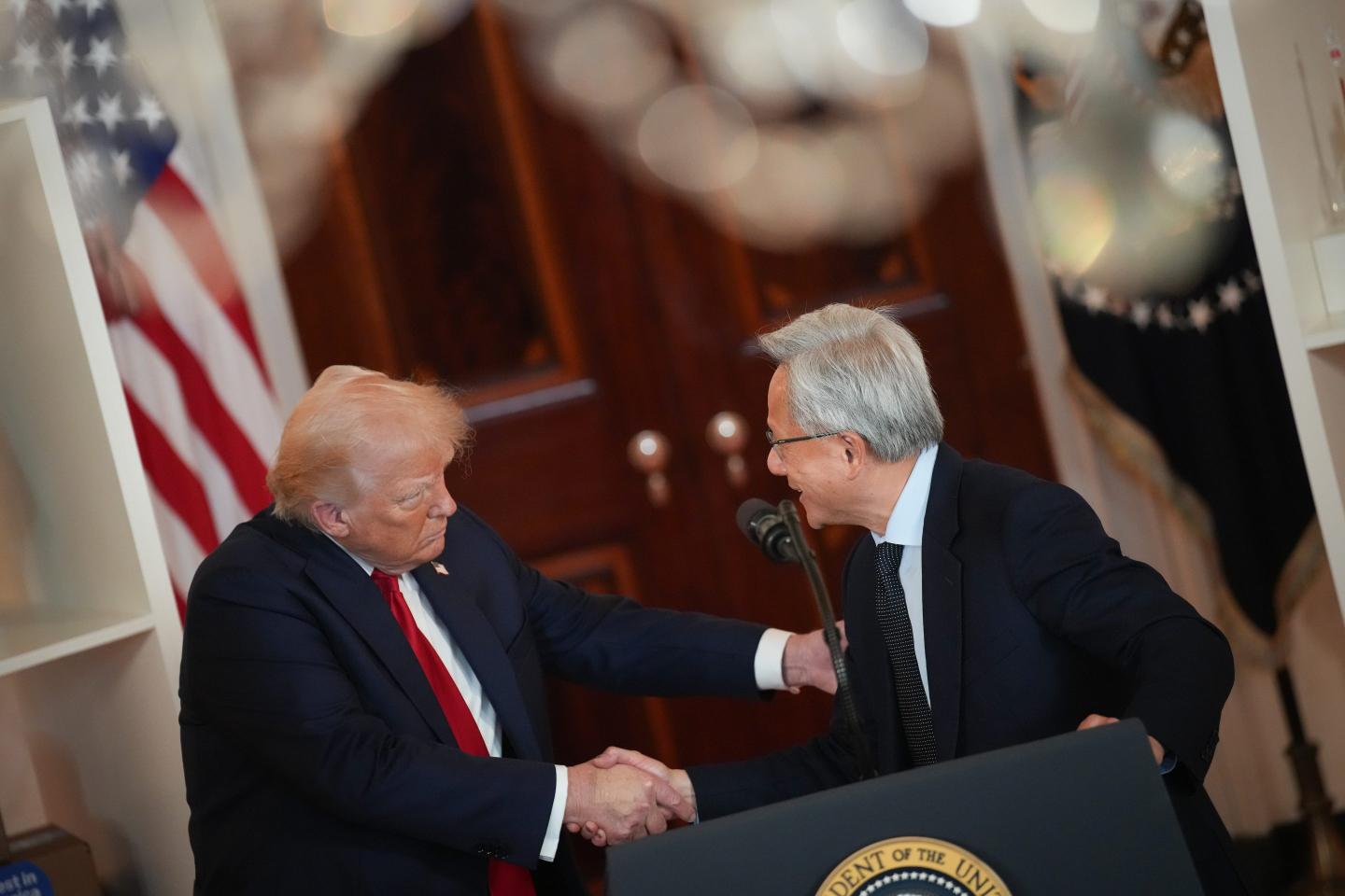 Donald Trump shakes hands with Nvidia CEO Jensen Huang