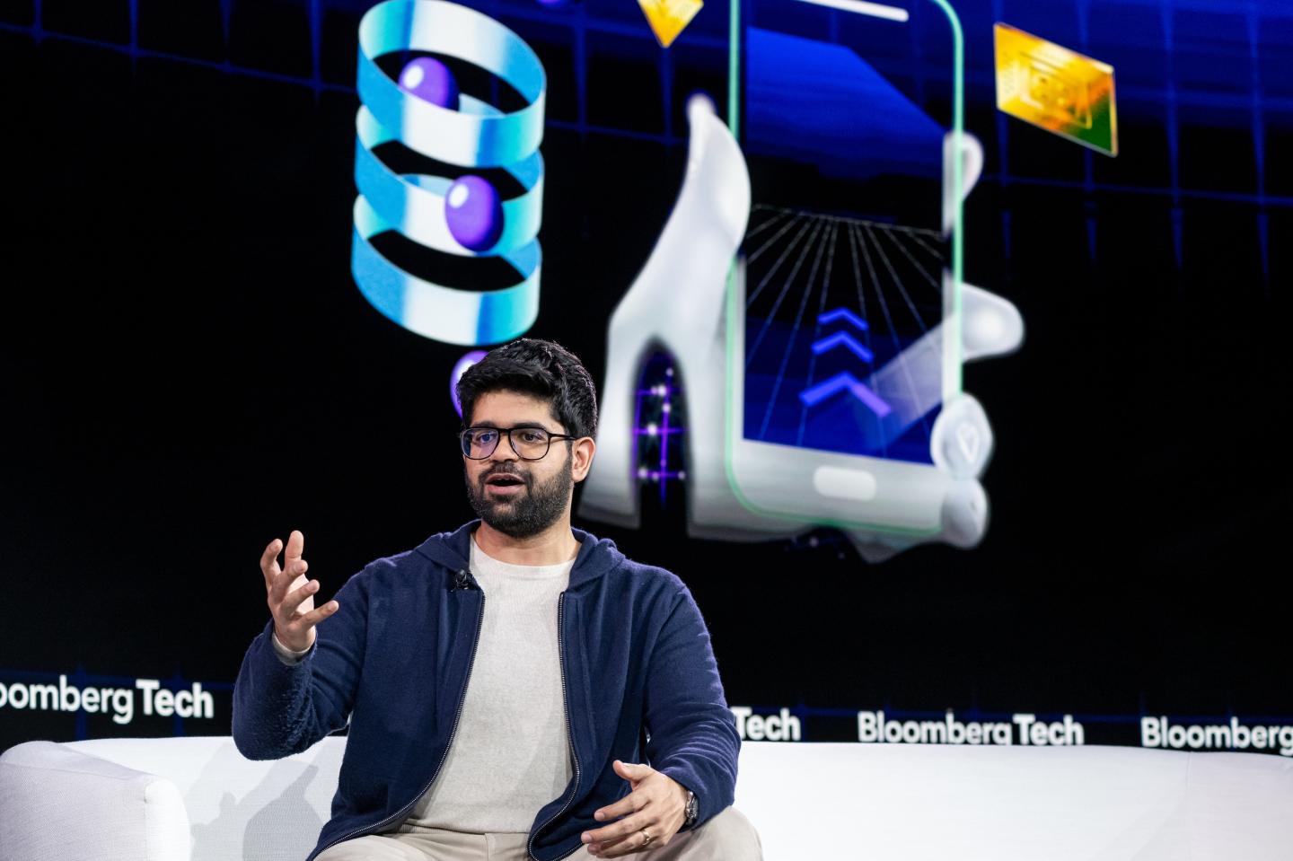 Aravind Srinivas speaking on stage.