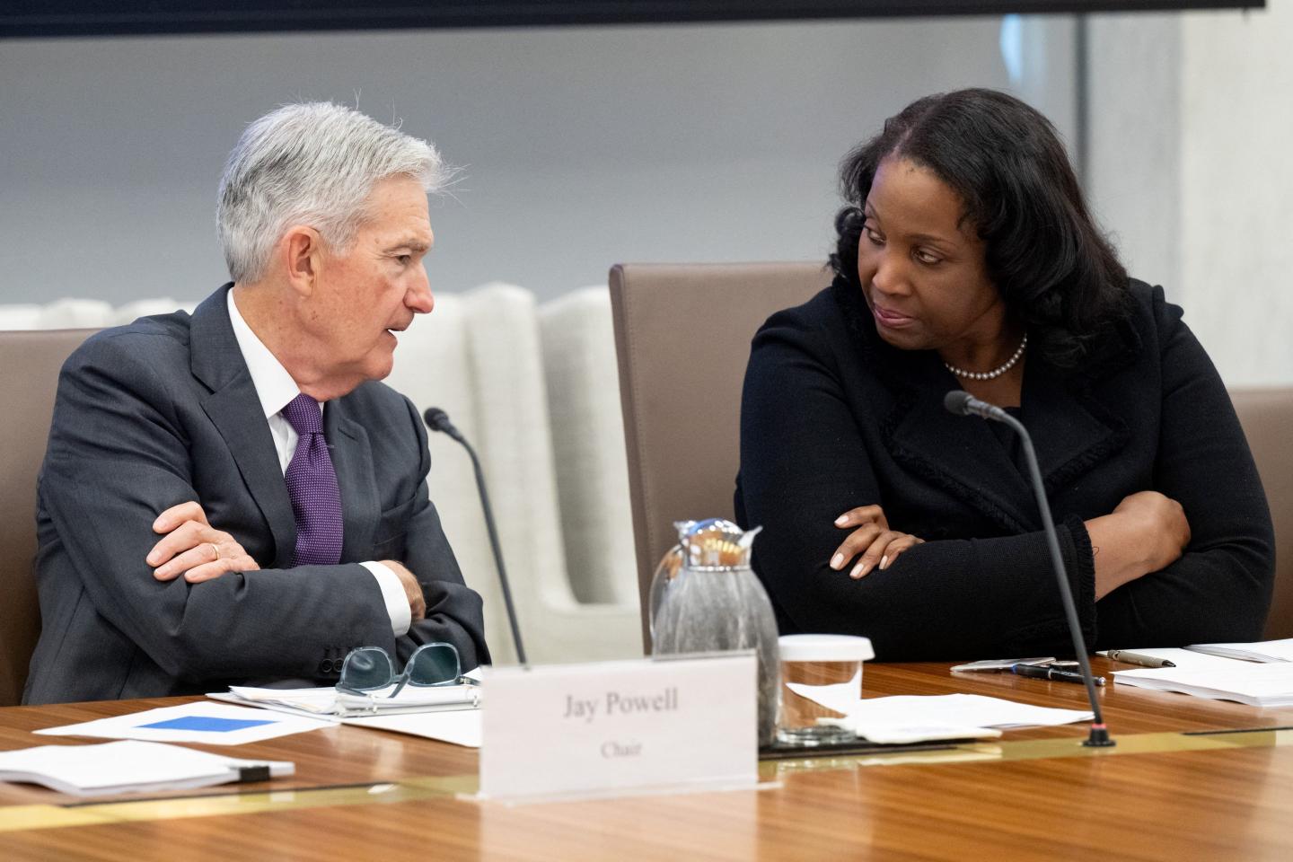 Chairman of the US Federal Reserve Jerome Powell speaks with Lisa Cook, member of the Board of Governors of the Federal Reserve during a meeting.