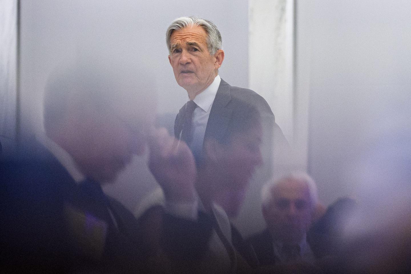 Attendees are seen in reflection as Federal Reserve Chairman Jerome Powell arrives for the Integrated Review of the Capital Framework for Large Banks Conference at the Federal Reserve on July 22, 2025 in Washington, DC.