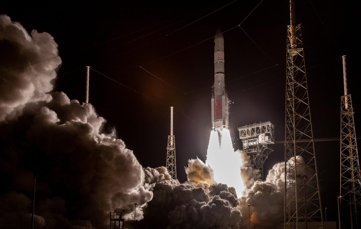 A rocketship launches with a lot of smoke into space