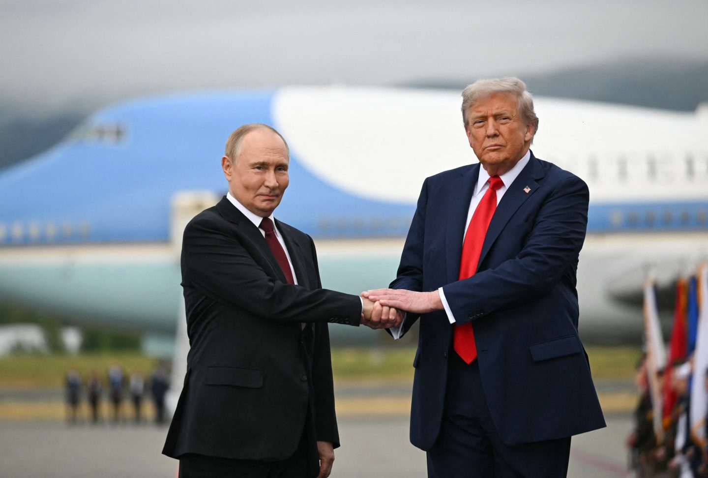 President Donald Trump shakes hands with Russian President Vladimir Putin on the tarmac after they arrived at Joint Base Elmendorf-Richardson in Anchorage, Alaska, on Friday.