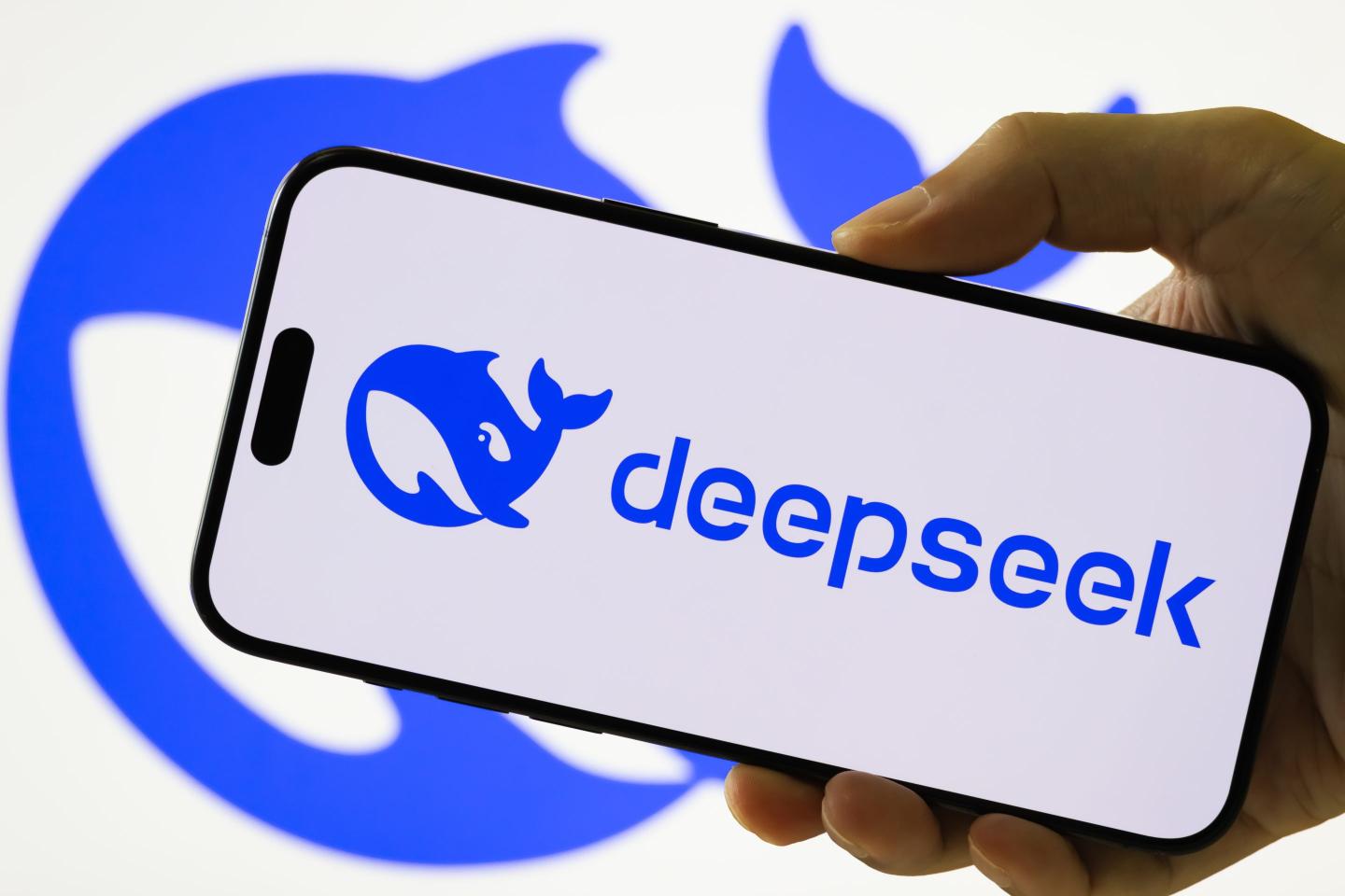 Mobile phone displaying the logo of Chinese AI company DeepSeek.