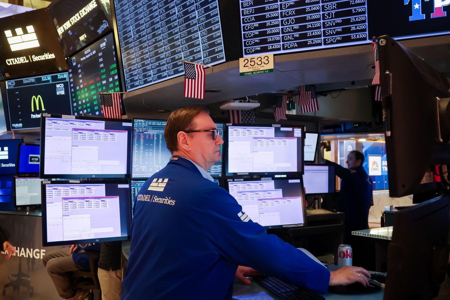 Traders work on the floor at the New York Stock Exchange on Monday.