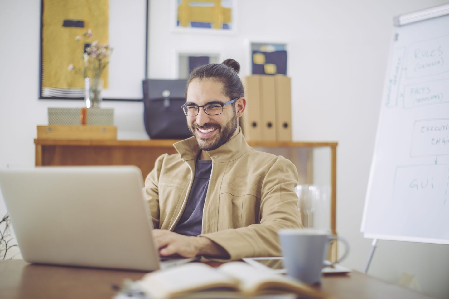 Gen Z man working on a laptop